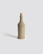 Decorative bottle with a cork stopper on a light gray background